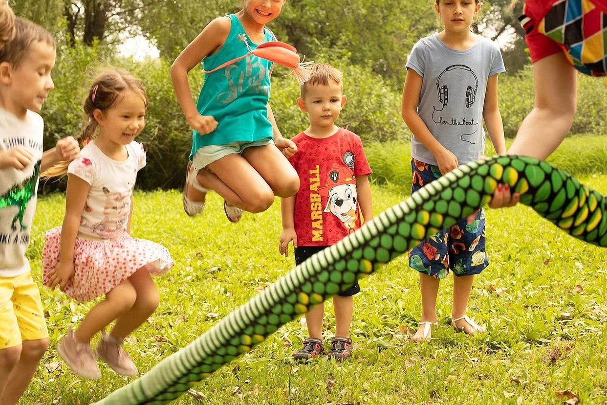 Children playing outdoors with balloons